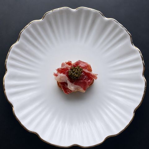 Manchego Croquettes topped with Ibérico ham and caviar