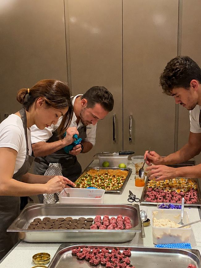 Alejandro's team preparing canapés together ahead of a private event