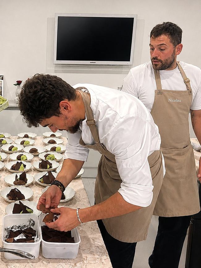 Alejandro and a fellow chef plating chocolate desserts